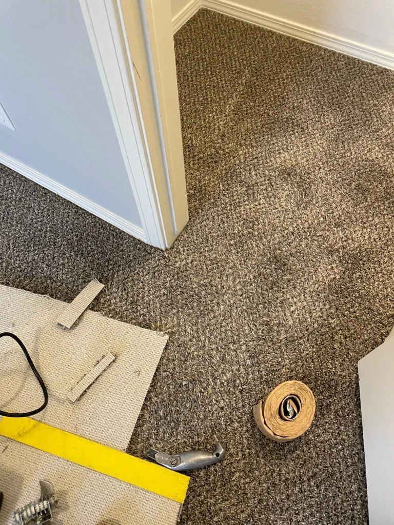 Carpet repaired with new patch.